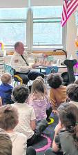 Sussex County Sheriff Michael Strada reads to first-graders at Ogdensburg Elementary School. (Photos provided)