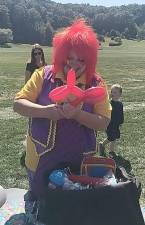 TaLOOlah the clown makes a balloon animal during Hardyston Day