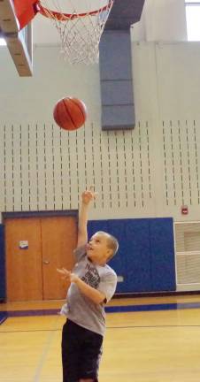 Crossroads basketball camp comes to area Nine year old Tristan Ortega of Newton shoots the basketball.