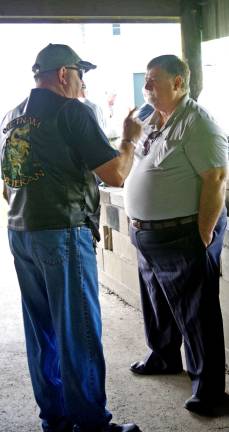 Photo by Chris Wyman At right, Sussex County Freeholder Phil Crabb listens to concerns of a Vietnam-era veteran.