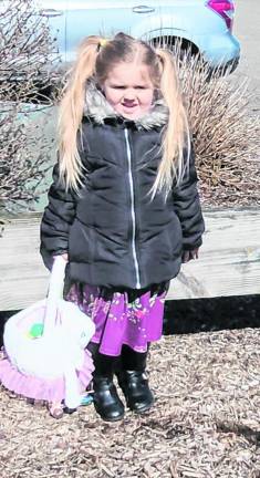 Scarlett Speer, 5, of Franklin holds a basket with her eggs. Children ages 2-10 took part in the annual Easter egg hunt sponsored by thhe Hardyston Township Recreation Committee.