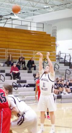 Wallkill Valley's Andrew Pustelniak (11) shoots from the free throw line.