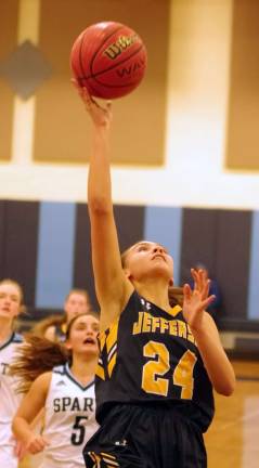 Jefferson's Mackenzie Rock takes the ball towards the hoop during a shot in the third period. Rock scored 10 points.