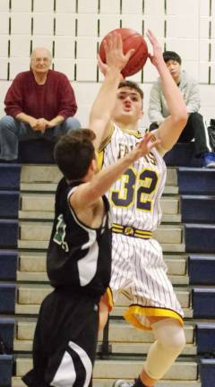 Jefferson's Connor Brown (32) jumps high during a shot. Brown scored eight points.