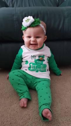 This is Codyre's first St. Patrick's Day, and she is a true leprechaun! Her name comes from her great grandmother's maiden name, who was born in Ireland. There are only about 65 people with the last name Codyre, most of whom live in Ireland! We love our sweet little Irish lass! Photo courtesy of April.