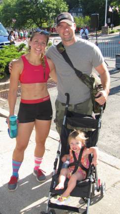 Racer, Melissa Geaney of Lafayette, with husband, Patrick and daughter, Juliette after the race