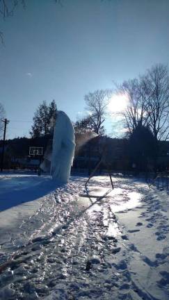 Tom Holmes's ice sculpture is taking shape at the Ann Street Park rink. &#x201c;It&#x2019;s a give and take between mother nature and Tom,&#x201d; joked organizer Mike Carson. (Photo by Anya Tikka)
