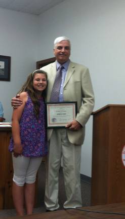 Jessica Haig is shown with Hamburg Mayor Paul Marino after receiving a junior citizen award.