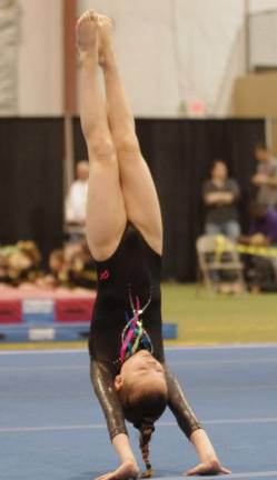 Samie Copley of Vernon does a hand stand.