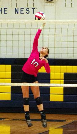 Jefferson's Lauren Liaci leaps to strike the ball in the first set. Liaci accomplished 3 kills, 2 assists and 8 digs.