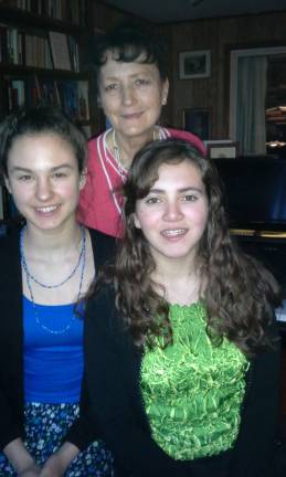 Pianists perform at Warwick church Maya Rakoczy, left, and Mikhaila Sanchez, right, are pictured with their teacher Margaret Korczynski.
