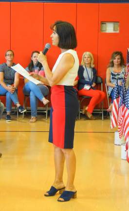 PHOTOS BY VERA OLINSKI Principal Rosemary Gebhardt introduces the Cedar Mountain Patriotic Sing-Along.