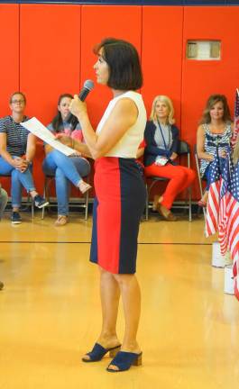 PHOTOS BY VERA OLINSKI Principal Rosemary Gebhardt introduces the Cedar Mountain Patriotic Sing-Along.