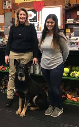 PHOTOS BY LAURIE GORDON Jan Hopper, the owner of Pawsitively, dog trainer, Carla Torppey, and Gucci, the store's mascot.