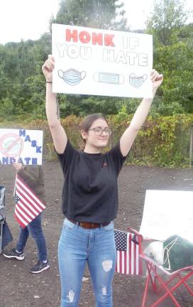 Anti-mask protestor in the afternoon before the meeting, on the highway across from Delaware Valley High School (Photo by Frances Ruth Harris)