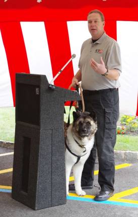 Brad Cole of the Connecticut-based K9 First Responders addressed the crowd with his Akita named &quot;Spartacus Chooch.&quot; Spartacus is a therapy dog and a K9 First Responder. According to Cole, Akitas are well-known for their strength, loyalty, persistence, and love of family.