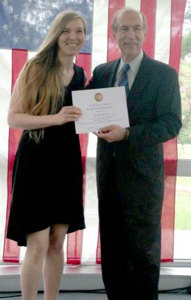 Rebecca Marxen receives a certificate of congressional recognition from U.S. Rep. Scott Garrett.