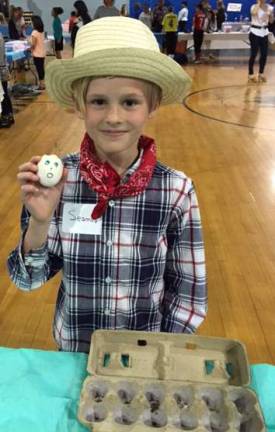 Fourth Grade &#xfe;&#xc4;&#xfa;Growing Smiles&#xfe;&#xc4;&#xf9; business owner Seamus Cummings sold out of his egg planters at the TREP$ Marketplace.