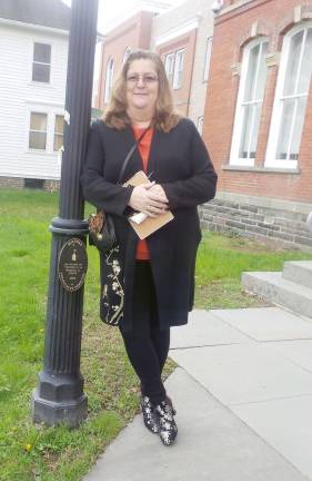 80-year-old prisoner pleads guilty to stalking, threatening, and tire slashing John Curwood's daughter Joy McCann just before she enters Pike County Courthouse to hear her father's guilty plea on April 15. Her letter pleading her father’s case appeared in a recent edition of the Courier. (Photo by Frances Ruth Harris)