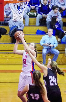 Lenape Valley's Carly Tarnowski raises the ball towards the basket.