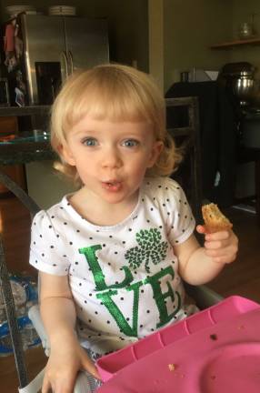 Hailey (2.5 years old) is enjoying her Irish soda bread on St. Patrick&#x2019;s Day!
