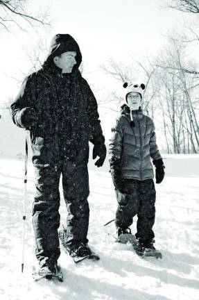 Winter Wonderland at Winter Festival Photo by Nick Ortiz Richard with Casey Kruk snowshoeing during winter festival, resident of Wantage.