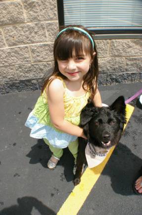 Brookelynn Gargano, 4, of Vernon plays with Miley, her Border Collie/Lab mix.