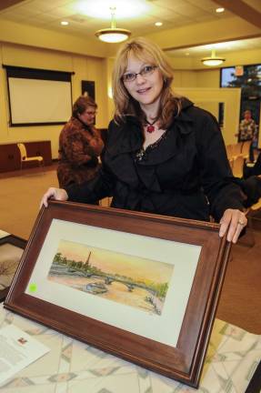 Artist Liza Smith Simpson of Andover and one of her works made about a scene in Paris.
