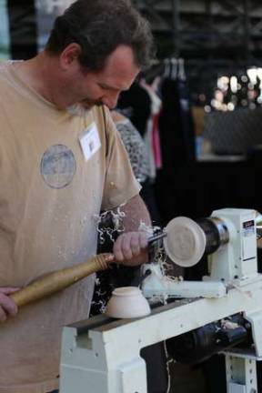 Steve Antonucci of Byram Twp. uses wood turning to create a bowl with fitting lid.