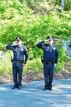 Photos: Memorial Day service in Ogdensburg Police officers salute.