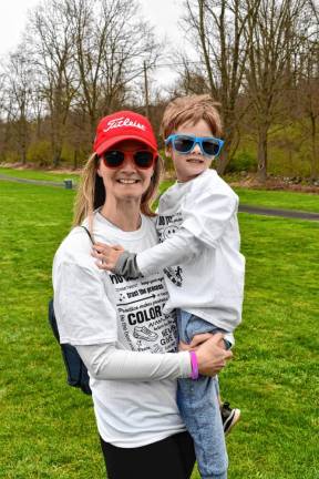 Janet Welsh of Hamburg holds her son Jace at the Color Run.