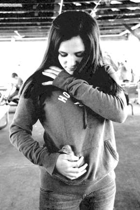 Poultry Fanciers Association holds spring show Amanda Brauchle of Montaque keeping her new duckling warm in her pocket.