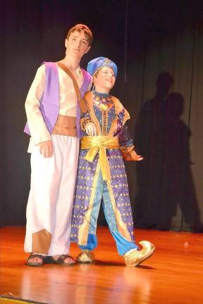 The Genie, played by Troy Rassmussen, illuminates the possibilities to Aladdin, played by Vincent Cantu.