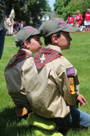 Scouts Abel Soares and Anthony Ciaparra listen as Flanders Fields is being receicted at Franklin Boroughs memorial service.
