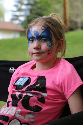 Kylie Burns of Vernon was transformed into a butterfly at the Owiepalooza fundraiser in Franklin on Saturday.
