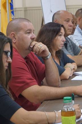 The Ogdensburg Borough Council listens to the public at the Heater's Pond Dam on July 27.