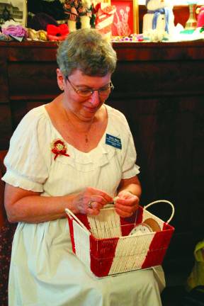 Betty Manzi of Franklin makes yo yo's from scrap material for quilts and pillows.