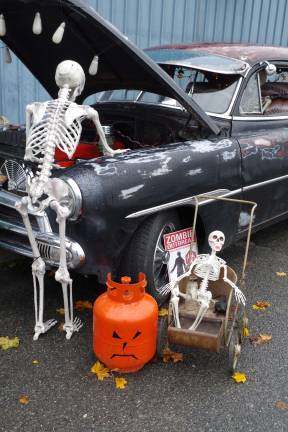 A scary car scene including a sign warning about a Zombie Outbreak greeted visitors at the 4th Annual Dog Walk of the Dead.