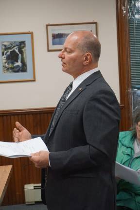 Photo by Vera Olinski Ogdensburg Municipal Auditor Thomas Ferry reviews the budget at a Public Hearing on Monday, April 13.