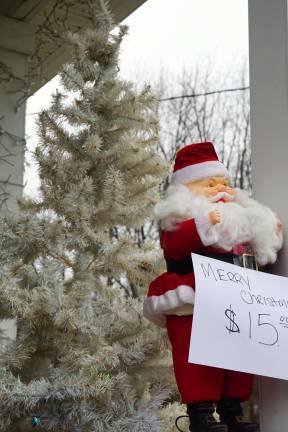 Christmas tree and Santa greet Shoptique shoppers.