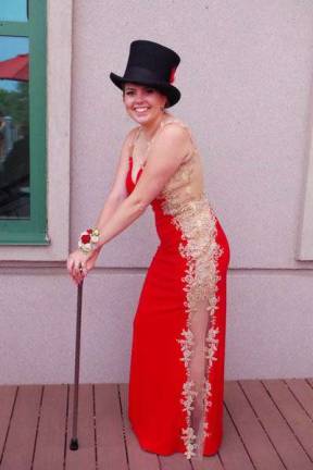 Who is the girl wearing the top hat at the prom?