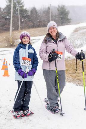 Greycey Steady, 11, of Highland Lakes was the youngest participant in the Viking Snowshoe Invasion. She snowshoed down the mountain with her mom, McKay, right.