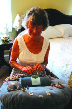 Christel Klug of Astoria, N.Y.,works on a bookmark doing bobbin lace.