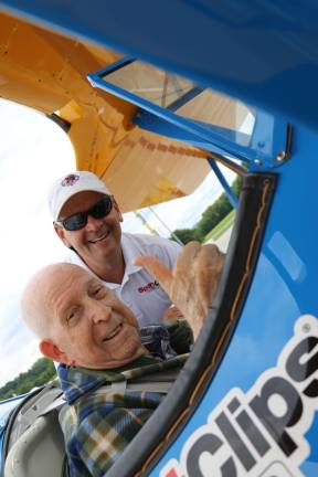 Vets soar at Sussex Airport Photos by Don Webb World War II veteran Lawrence Spulick gives the thumbs up as he gets into the Boeing Stearman biplane. He is helped by Tim Newton of the Ageless Aviation Dreams Foundation.