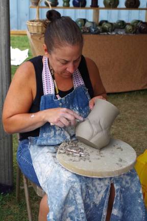 Newton-based potter and ceramic artist Sharon Pflug-Moench was on hand to throw and the carve clay vessels.