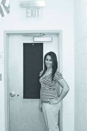 Teacher invents window coverings for school safety Co-owner Christine M. Bacolas showing the Hideaway Helper on a classroom door