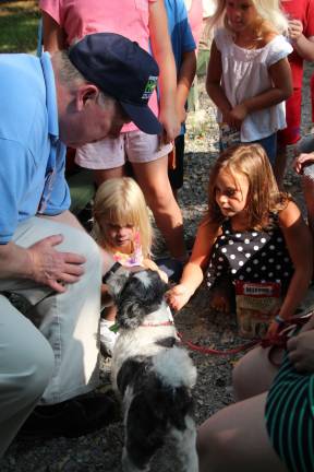 Pastor Daniel Gepford of Sussex United Methodist Church holds a pet blessing in Sussex Borough.