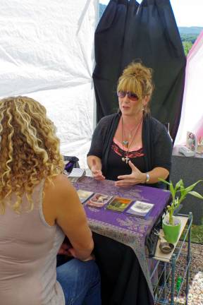 Hamburg business hosts wellness festival in Vernon Jacqui Geary of the Trinity Metaphysical Center performs a tarot card reading for a client. The center is located on Route 23, north of Route 94 in Hamburg.