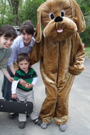 Lafayette celebrates its historic district with fair Michael McDonald and sisters BethAnne and Jenny with dog character promoting Fuzzy Nation's pet adoption.