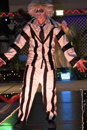 These fashionistas know how to sew Frank Rocco as Beetlejuice wears an outfit of his own design.